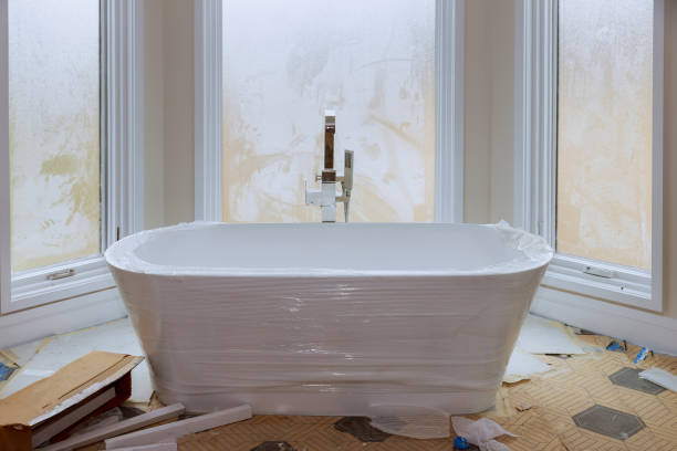 Expert Bathroom Remodeling Services in Sunrise Manor, NV Need Expert Bathroom Remodeling Services in Sunrise Manor, NV? Learn about Best Bathroom remodeling in Sunrise Manor, NV, local costs, and desert-safe materials. Updating a home in the shadow of Frenchman Mountain requires more than just an eye for style. Property owners in the Northeast Las Vegas Valley must account for specific regional stressors like high-alkaline water and intense solar heat. Finding Expert Bathroom Remodeling Services in Sunrise Manor, NV provides the structural safety and material knowledge needed to build a space that lasts. Choosing a local provider like GNK, LLC helps guarantee your investment remains protected against the unique environmental demands of Southern Nevada. Sunrise Manor residents often face challenges such as grout cracking or plumbing scale buildup that can ruin a new installation quickly. Have you checked if your current subflooring can support the weight of a heavy stone soaking tub? Professional intervention identifies these logistical hurdles before they compromise your aesthetic goals or property value. Our regional experience focuses on moisture-resistant barriers and durable hardware for every residential project. Why Clark County homeowners choose specialized bathroom updates If you live in a dry climate, there is constant thermal expansion in your home walls and flooring. Neglecting the effect of low humidity on tile setting or waterproof membranes during a badly managed update could affect safety. It is an American style that has grown. According to the Census Bureau (2024), the principal factor for raising property utility and value in the Nevada area remains residential investment. According to these findings, durability of materials such as wood is highly appreciated and does not require as much repair. For families safety comes first, and modern high-performance lighting and steam showers tax electrical circuits. A team of professionals would identify any possible issues with ventilation or circuit loads before it can become hazardous. Does your existing electrical panel accommodate the heating demands of a new towel warmer? Professional maintenance and good quality materials will highlight potential issues before they become costly ones. Home equity remains attached to the quality of permanent features like quartz surfaces and custom cabinetry. Top-notch finishes will not fade as the lower-grade finishes would. Companies such as GNK, LLC that focus on these durable solutions specifically for Sunrise Manor property owners understand the local conditions and permit process. Best Bathroom remodeling in Sunrise Manor, NV: Options and Materials Selecting the right components for your property requires balancing your visual goals with the reality of desert living. For those seeking the Best Bathroom remodeling in Sunrise Manor, NV, choosing the correct material tier is the first step toward a successful project. Material Tier Avg. Cost Rating Best For Maintenance Natural Stone Mid-High 5/5 Heat Resistance Medium Ceramic Tile Low-Mid 4/5 Budget Flexibility Low Engineered Quartz High 5/5 Countertop Durability Low Solid Wood Mid 3/5 Classic Vanities Medium In Sunrise Manor, engineered quartz has a stone appearance without being porous, which means it doesn't trap the hard water minerals found in the locality. Though wood vanities are a classic favorite, they need sealing to prevent warping from our dry air over time. By employing advanced materials in your home, it does not weaken by rupture impact and remains aesthetically pleasing as well. The remodeling process as experienced by professionals. The work begins with a full site survey to check the presence of any old electrical wiring and plumbing, structural wall constraints and more that could hamper your design. We routinely change out damaged or dated subflooring and drywall for high-durability options, providing a solid base for the new shower system. During this phase, we take care of your drainage requirements at your home to control the effect of hard water. Have you seen a slow drain or lime scale on your showerhead? The only way to have a stable result that can protect your home is fixing those issues during the first assessment. The second step is prepping the workspace and putting down protection on any existing floors and furniture. Our calculations provide the precise shape and size you need based on your fixture specifications and workflow, and the site will be OSHA (2024) compliant for workers’ safety. The verification of the plumbing rough-in stage with the technical drawings is detailed and the lighting fixture installation likewise. Before finishing the wall, we check the fit and function of each pipe and wire. The last things that will happen are the fixture installation, backsplash tiling, and verification of mechanicals. Our choice of flexible adhesives for tiling allows for thermal expansion common in Nevada and prevents cracking of the grout. A contractor in Sunrise Manor points out that checking for leaks and examining water pressure after a renovation prevents safety hazards later on. We leave only once the finish is perfect and the workspace is fully restored to your area of use. Bathroom Projects Sunrise Manor Price factors. When estimating a Northeast Valley renovation, you have to look at material durability and considerations related to your actual home. If your house is in an older subdivision with galvanized pipes, it may take us longer to replace the pipes, which may affect the overall labour cost. Data from Bob Vila (2026) shows that the cost of a bathroom project will generally fall into a range that reflects the complexity of the layout and the quality of the finishes. In unincorporated Clark County, any project moving gas lines or structural walls requires a permit. Your initiative can comply with the law and guarantee the long-term safety of your neighbourhood through legal measures. Many residents find hiring a professional to take care of the county paperwork saves time and will prevent problems during a future sale. The prices can differ due to the seasonal demand as many users try to have their interiors works done in the cooler months. In this way, we do not have to tax the air conditioning system as much. It takes longer to set up in established communities to protect landscaping and shared walls. Businesses like GNK, LLC will give you precise estimates so that you can budget accordingly. If you find proper renovation management today, you will not have to pay for cheap materials malfunctioning under the desert sun. How to select a qualified contractor local. To ensure expert bathroom remodeling services in Sunrise Manor, NV, check their Nevada State Business License. It’s essential to confirm that the provider has sufficient liability insurance to protect your property or utilities from accidental damages. A contractor who only does remodeling work in Sunrise Manor like GNK, LLC would have managed the local permit process and carry insurance specific to their trade that general handymen often forgo. Experts in our region know how wet and dry seasons can affect the drying times of sealants and the lifespan of plumbing sealants. They will recommend UV-resistant materials that can do well in the sunny weather we have. Providers from outside the region in general may not be aware that the local water’s high mineral content requires specialist filtration for high-end steam units. How many years has the crew been working in the Las Vegas Valley? Inquire with prospective partners on how they will manage dust during demolition. Can they provide a timeline that threads the needle of our extreme summer temperatures when the interior ventilation is limited? A local company known for its punctuality and transparent communication makes everything stress-free for your family. Going through testimonials from fellow Sunrise Manor tenants gives insight into how the team handles the logistical aspects of home renovation. Selecting a local professional ensures your project receives the technical attention needed for our desert environment. Conclusion Investing in a permanent renovation strategy is a practical way to improve your home functionality and market value. This process removes the worry of failing fixtures and provides a solid base for your family’s morning routine. By choosing a team that understands local heat and humidity needs, you ensure your project stays durable for many years. If you are ready to update your property, reach out to GNK, LLC for a free assessment of your site. Ask GNK, LLC about material options for your property to see which finish best fits your home style and functional needs. FAQs How do I find Expert Bathroom Remodeling Services in Sunrise Manor, NV? Verify the contractor credentials through the Nevada State Contractors Board to ensure they have an active license. Look for a team with extensive experience in desert-specific renovations and positive feedback from local neighbors. A modern homeowner should always ask for a clear list of services and a written cost estimate before work begins. What is the average cost for Best Bathroom remodeling in Sunrise Manor, NV? Minor bathroom refreshes usually start around $8,000, while full custom master suite remodels can range from $25,000 to $55,000 or more. The final price depends on the complexity of the layout changes and the current market cost of high-durability fixtures and stone surfaces. We provide transparent quotes to help you manage your renovation budget effectively. Do I need a Clark County permit for a bathroom remodel in Sunrise Manor? Cosmetic updates like painting or replacing a faucet do not require a permit, but structural, electrical, or plumbing changes do. The Clark County Department of Building and Fire Prevention requires permits for these tasks to ensure the work meets local safety codes. We can help you determine if your specific project needs county approval. How does the Sunrise Manor climate affect bathroom material durability? Intense heat and low humidity can cause certain sealants to shrink and low-quality adhesives to fail faster than in other regions. We use heat-resistant stone and specialized waterproof membranes designed to survive the Mojave Desert environment. Regular maintenance of caulking and ventilation helps identify these issues before they lead to structural damage. How long does a typical bathroom renovation take to complete? Expert Bathroom Remodeling Services in Sunrise Manor, NV